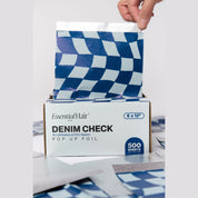 Hand pulling a Denim Check pop-up foil from the box